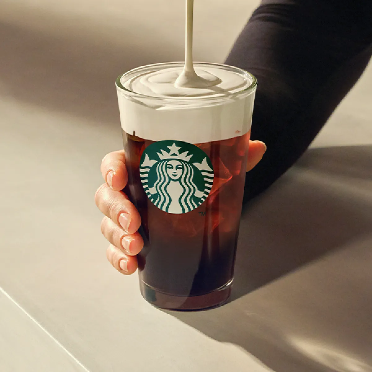 Iced Caramel Protein Americano being poured