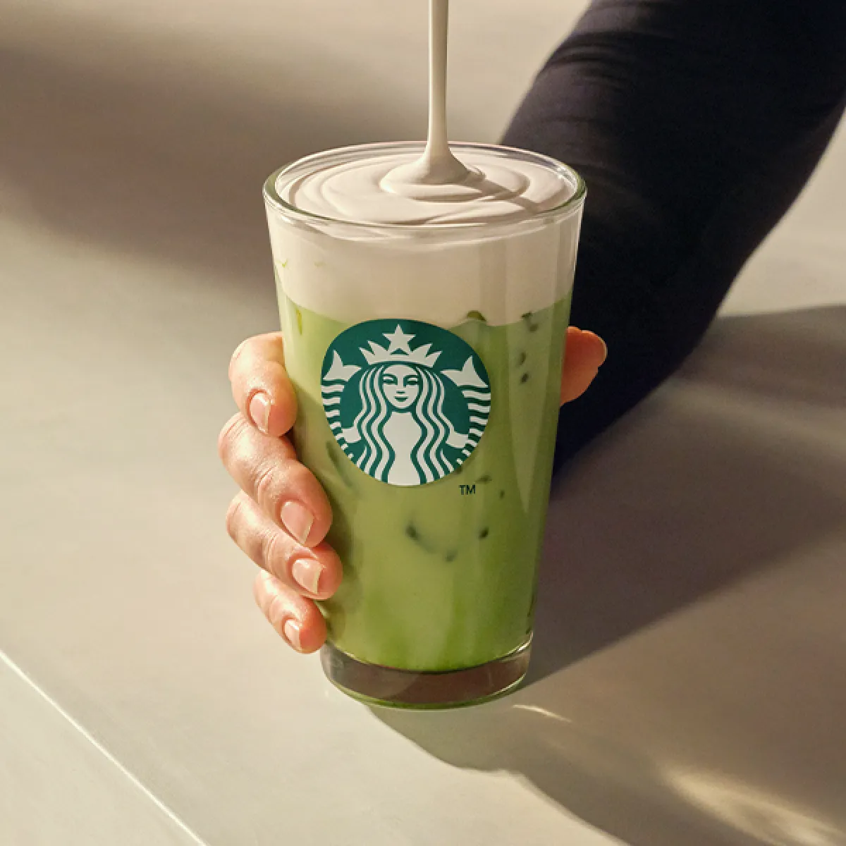 Iced Vanilla Protein Matcha being poured