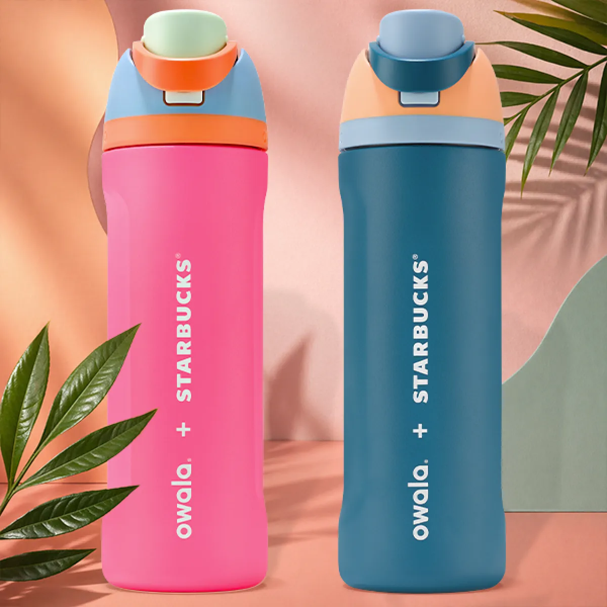A photo of our two new Owala™ FreeSip™ bottles, in 24 oz. One in a hot pink with green, orange and blue lid, the other in a dusky mid-Blue, with a light blue and peach lid.