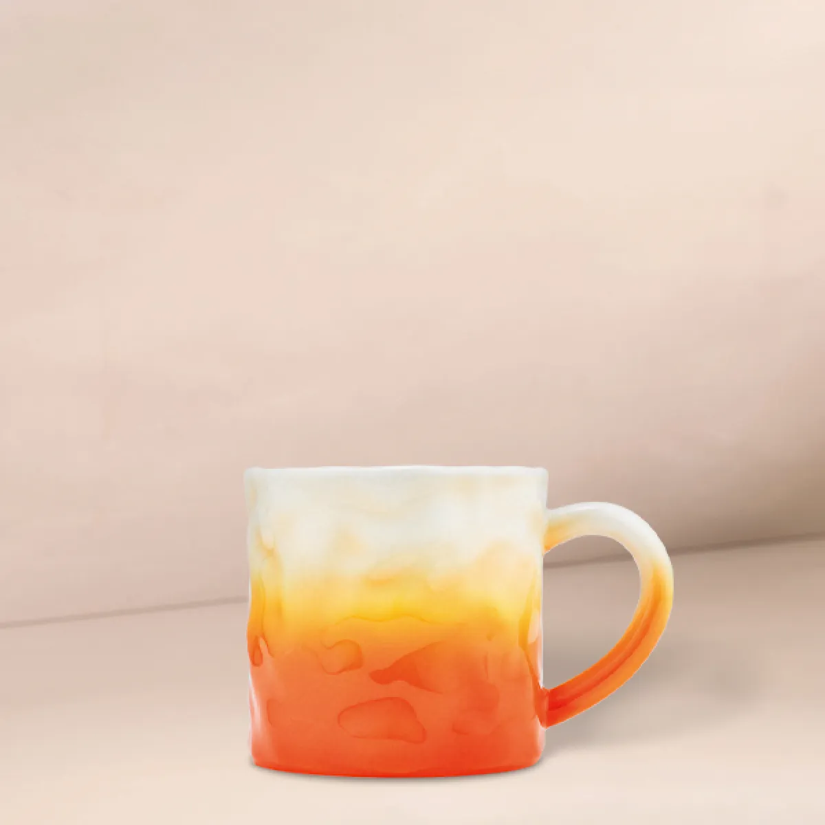 A photo of our new PSL flame mug - an orange to cream ombre textured design