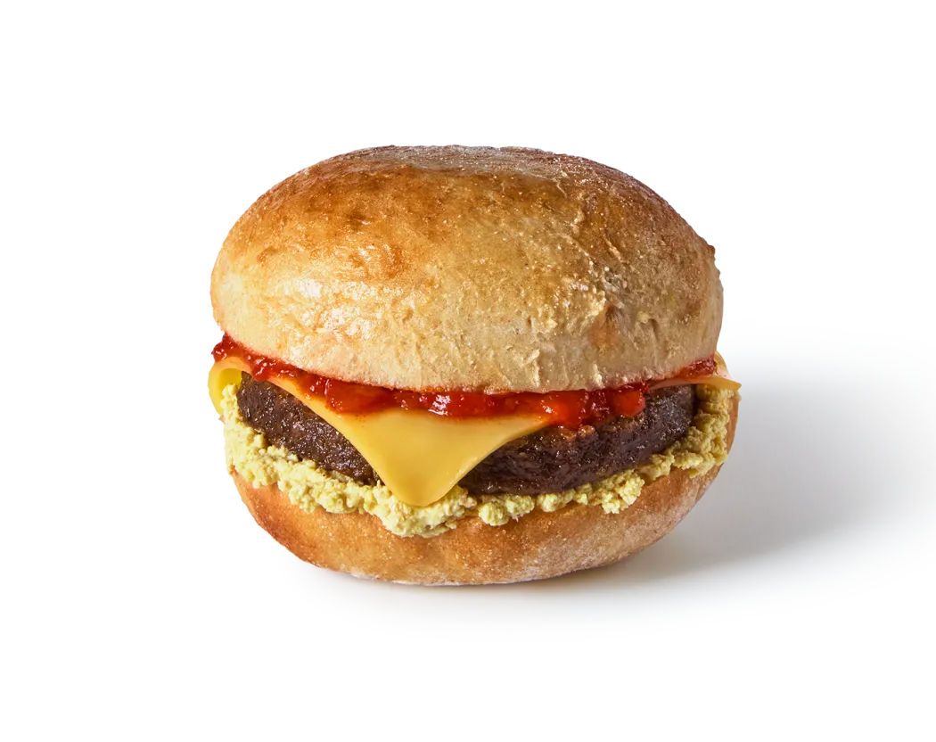 A photo of our beyond meat breakfast sandwich showing its layers of filling