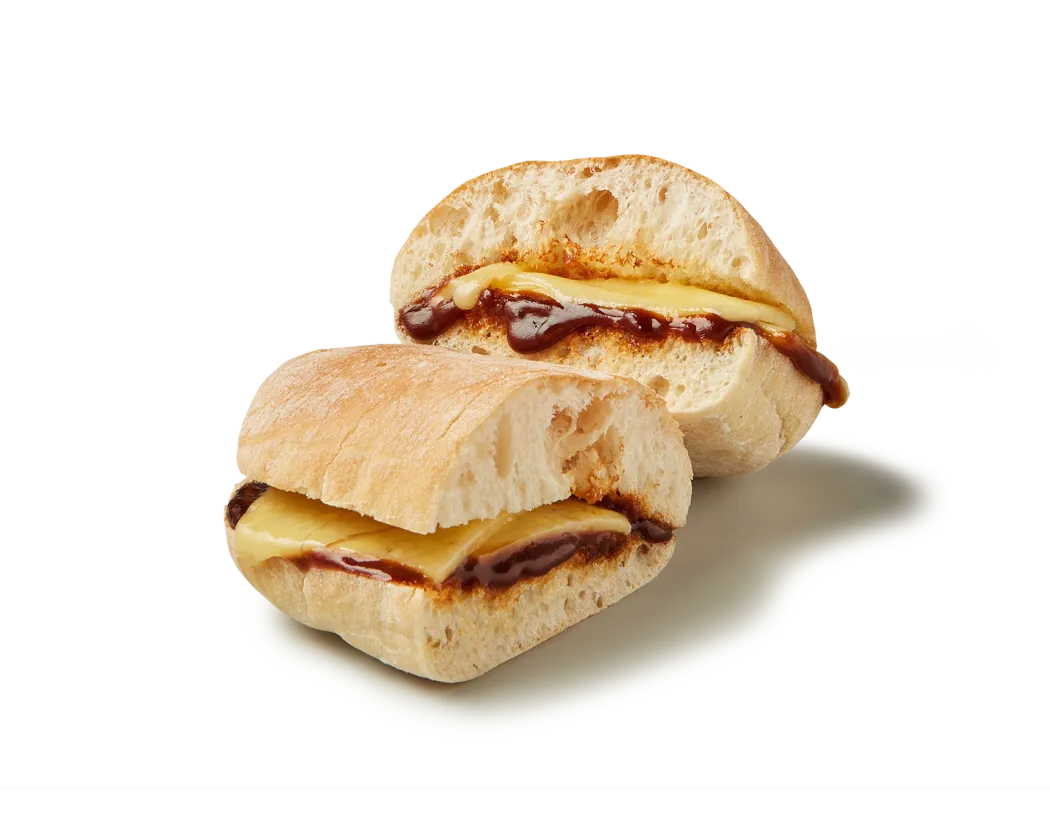 A photo of our classic Cheese &amp; Marmite® Mini Ciabatta showing the melty cheese and velvety marmite filling.