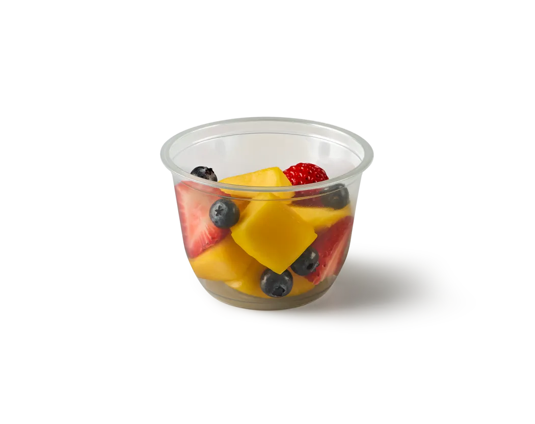 A photo of our new fruit pot, containing vibrant mango, strawberry and blueberries.