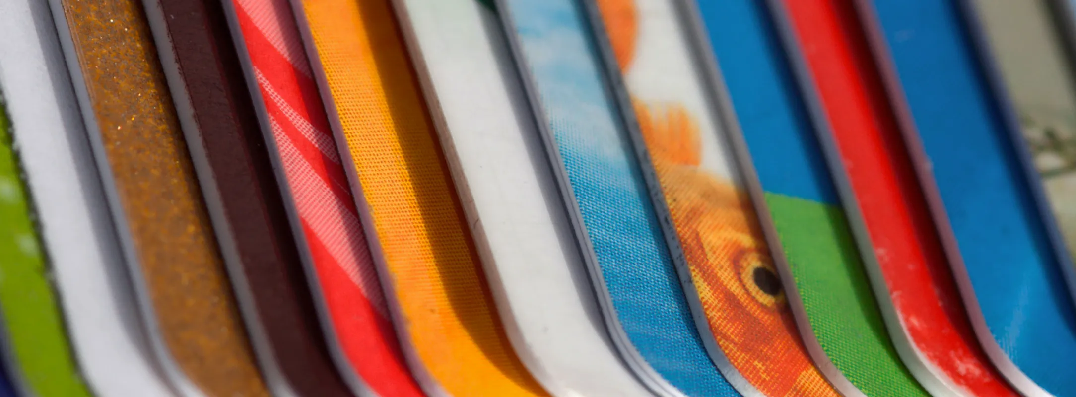 A close up photo of a pile of multi-coloured Gift Cards