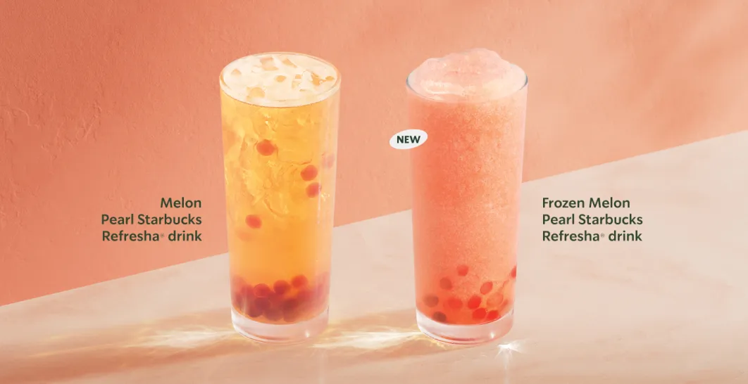 Two drinks - our summer sensation, Melon Pearl Starbucks Refresha drink with sweet melon flavour popping pearls - and now a blended version. Both sit on a table in front of a rich peach walled background.