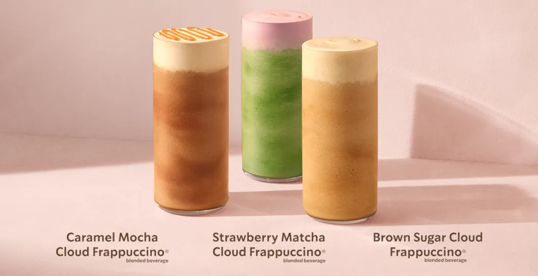 A range shot of our new Frappuccino® Blended Beverage Clouds in glassware on a dusky pink tabletop.